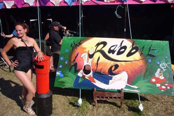 Here is Arabian tent Company founder Katherine posing with The Rabbit Hole stage sign when she first started the tent at Glade festival.