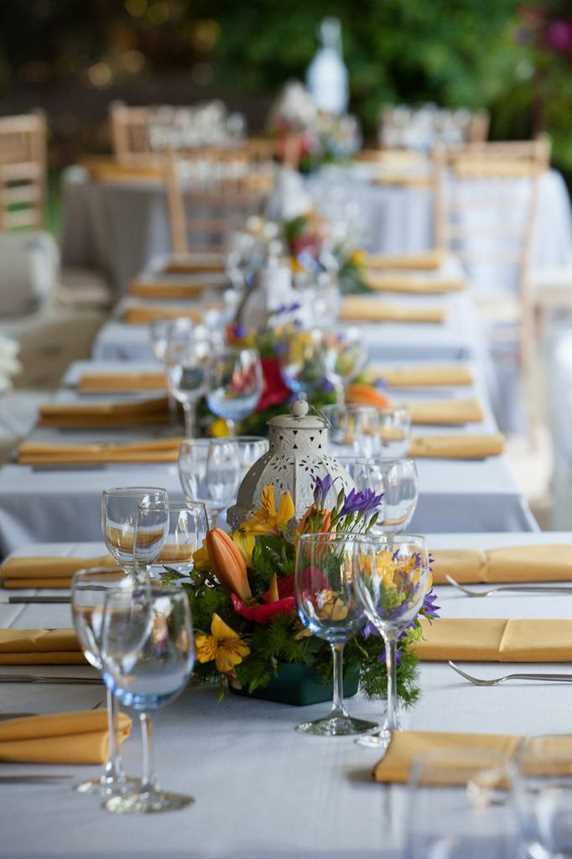 The tables were laid with pretty white Moroccan lanterns and brightly coloured flowers by Lewisiana Florists adding fresh pops of colour to the subtle marquee interior.